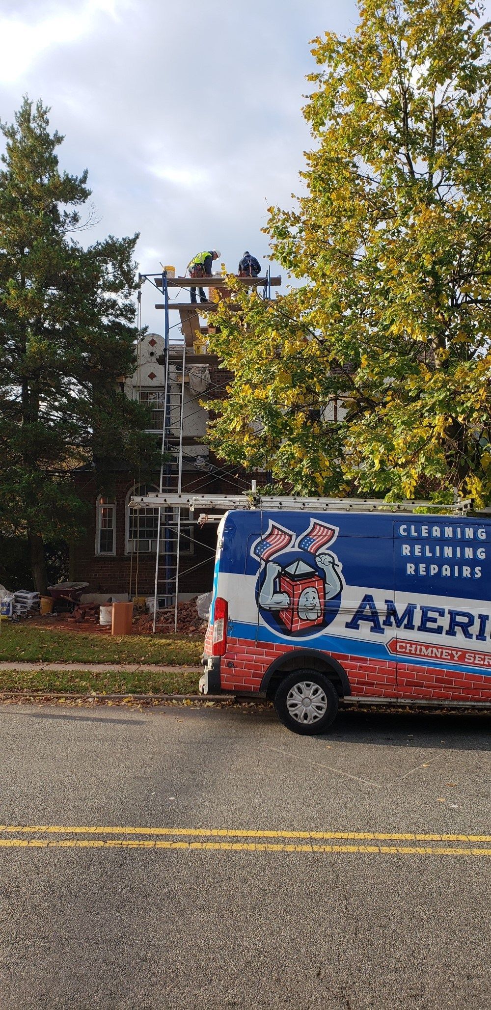 American chimney services van is parked on the side of the road.