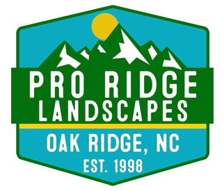Logo for Pro Ridge Landscapes: green mountains, yellow sun, white text on turquoise hexagon, "Oak Ridge, NC".