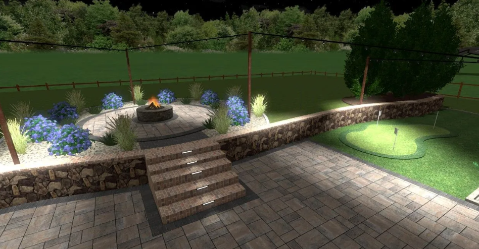 Backyard with fire pit, putting green, and stone patio at night.