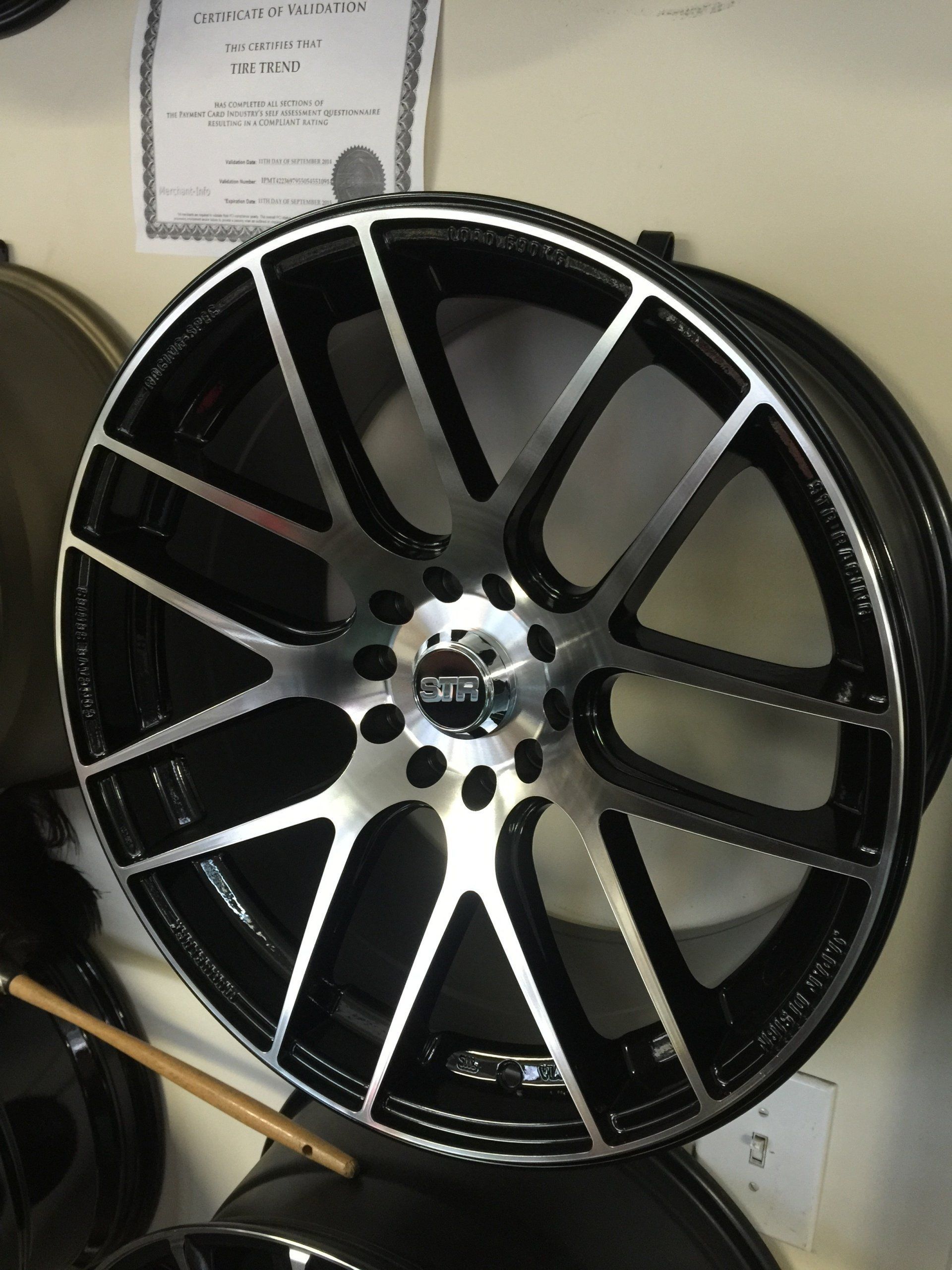 A black and silver rim with the word bmw on it