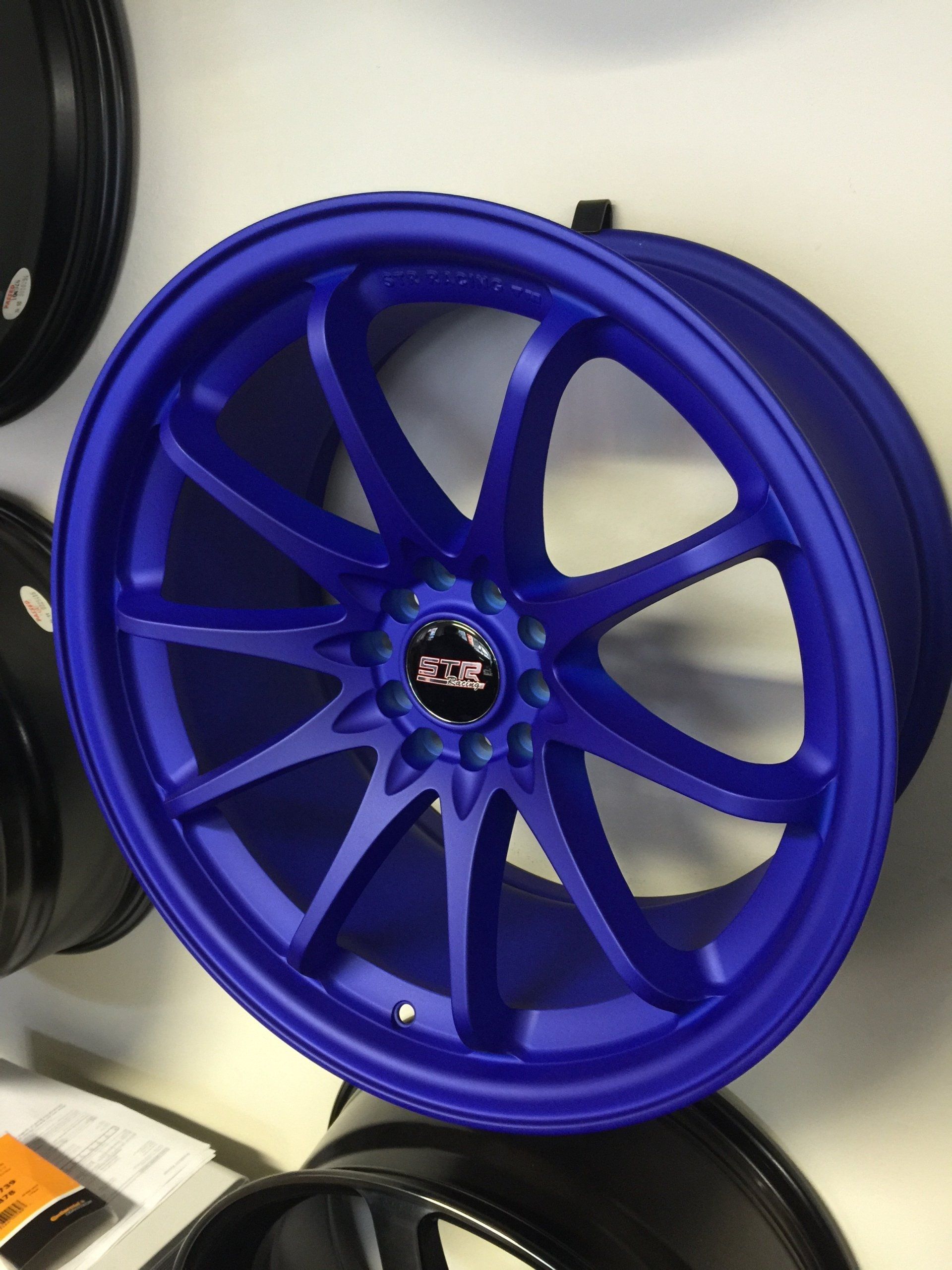 A close up of a blue xtr wheel