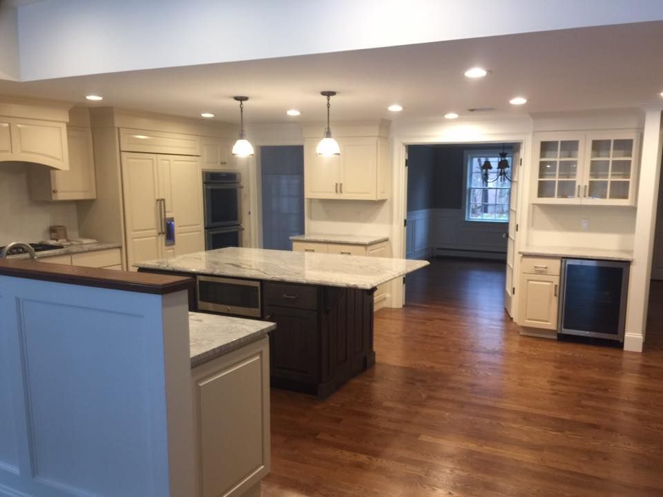 There is a large island in the middle of the kitchen.