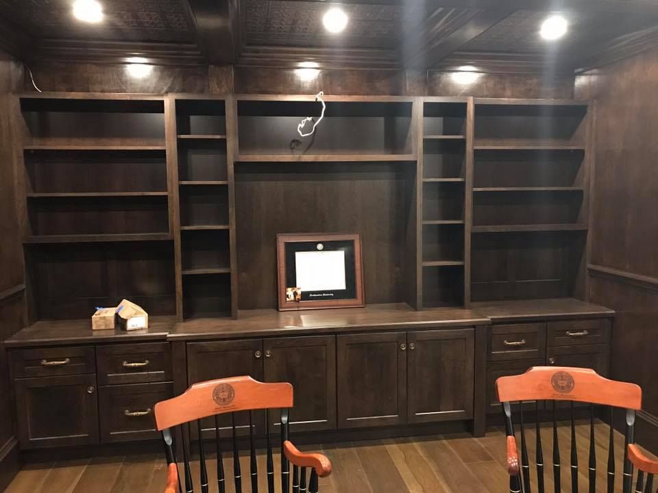 A room with a lot of shelves and chairs.