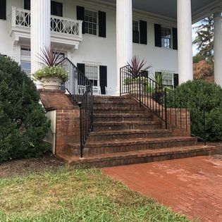 A white house with stairs leading up to it
