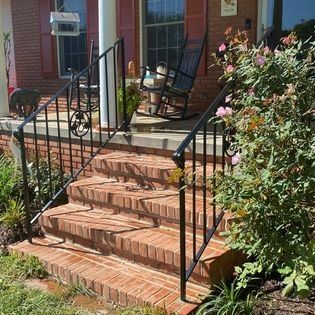 There is a rocking chair on the porch of a house.