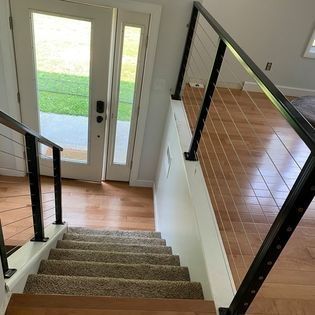 A set of stairs leading up to a door in a house.