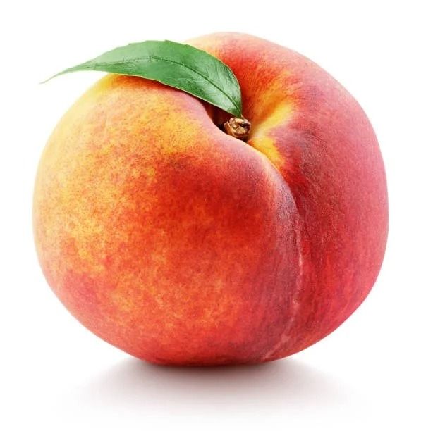 Ripe peach with red and yellow skin, green leaf, white background.