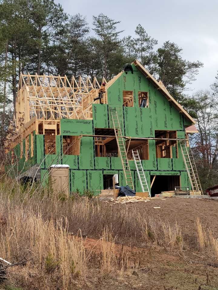 A house is being built in the middle of a field
