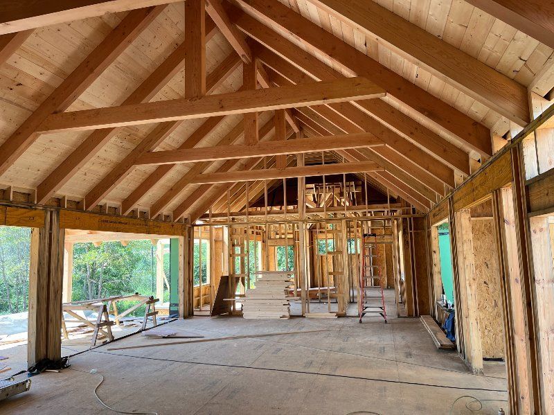 A large room with a vaulted ceiling and wooden beams.