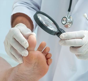 dermatologist examines the foot