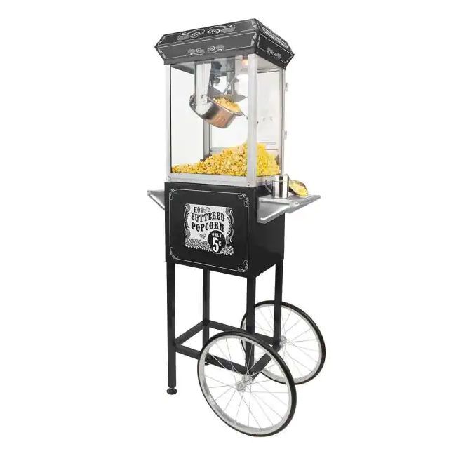 A black popcorn machine with wheels is sitting on top of a cart.