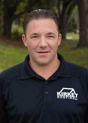 Man wearing a black polo shirt with 