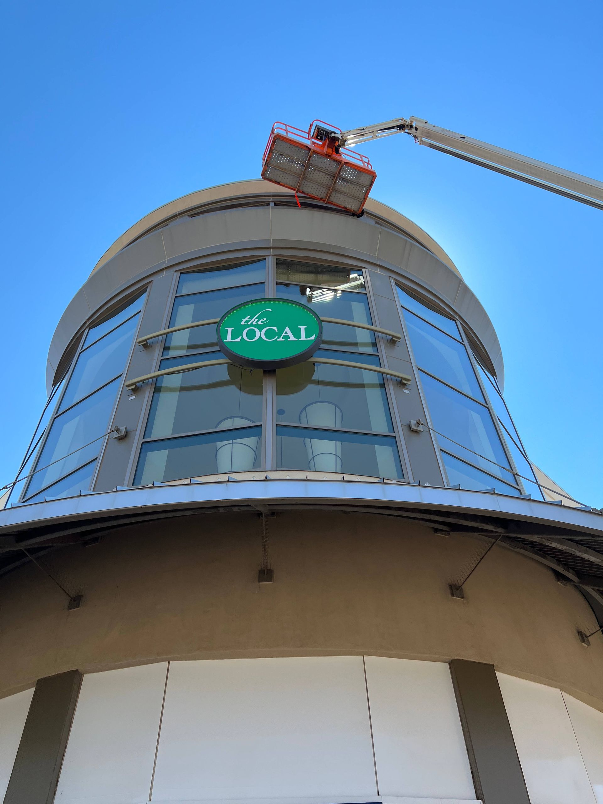 A cherry picker near a building's dome, with 