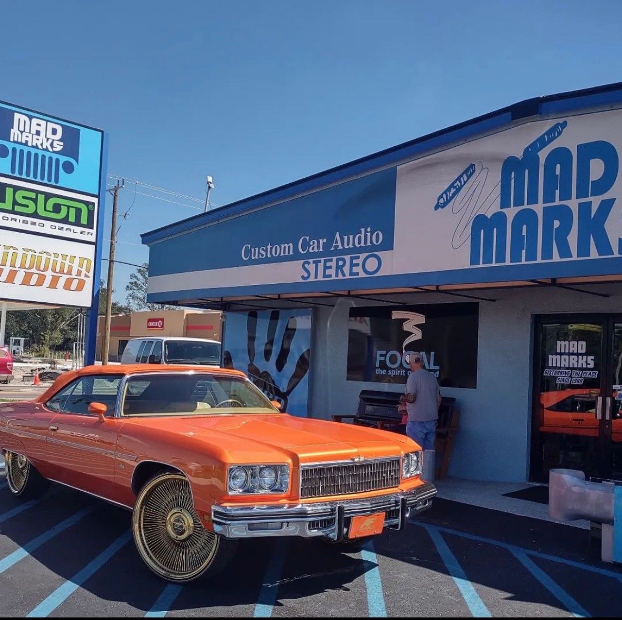 Car in front of shop