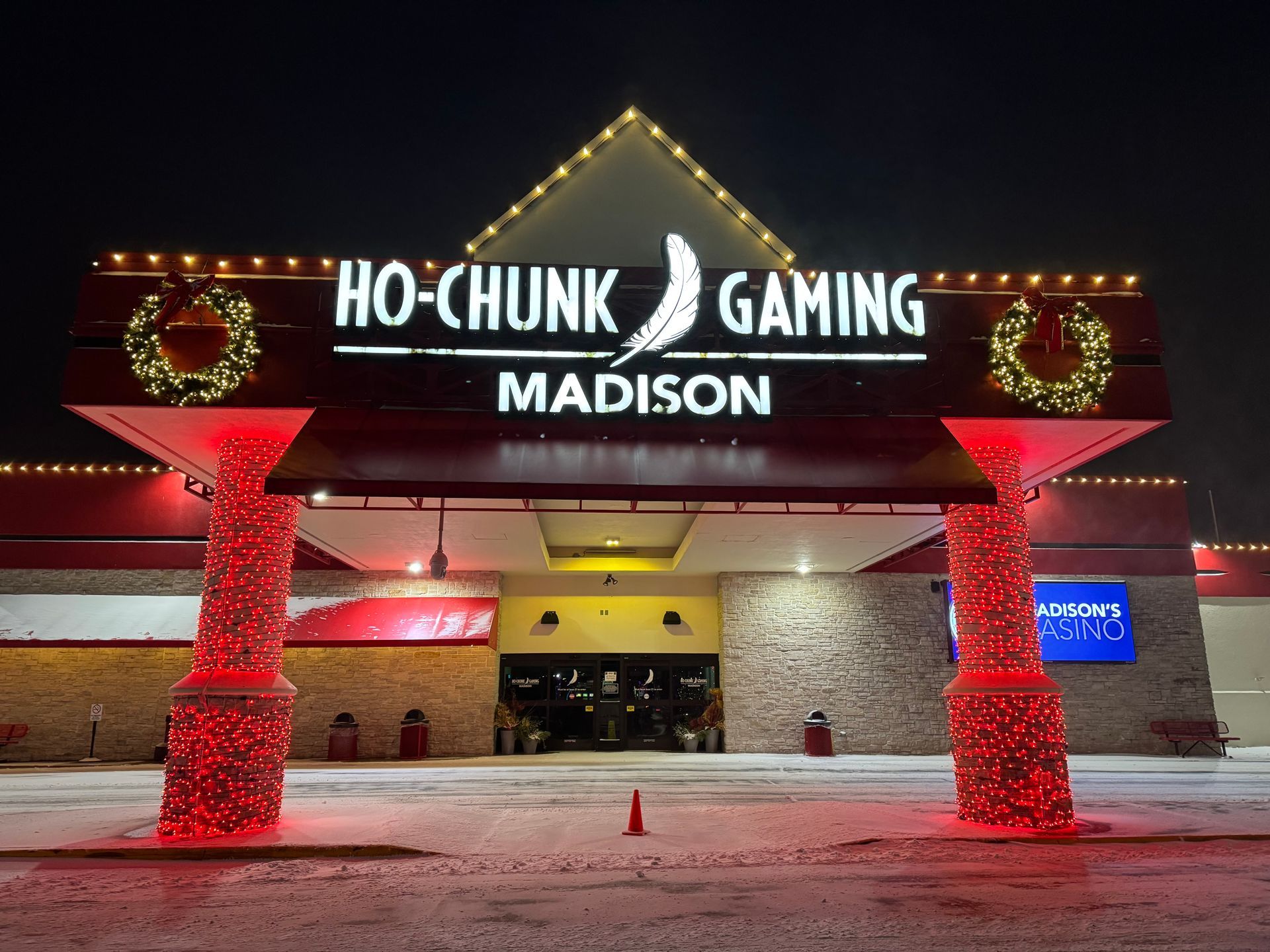 Ho-Chunk Gaming Madison entrance lit in red at night