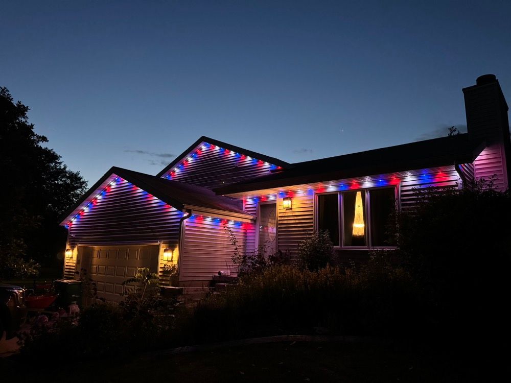 House decorated with colorful Christmas lights at dusk