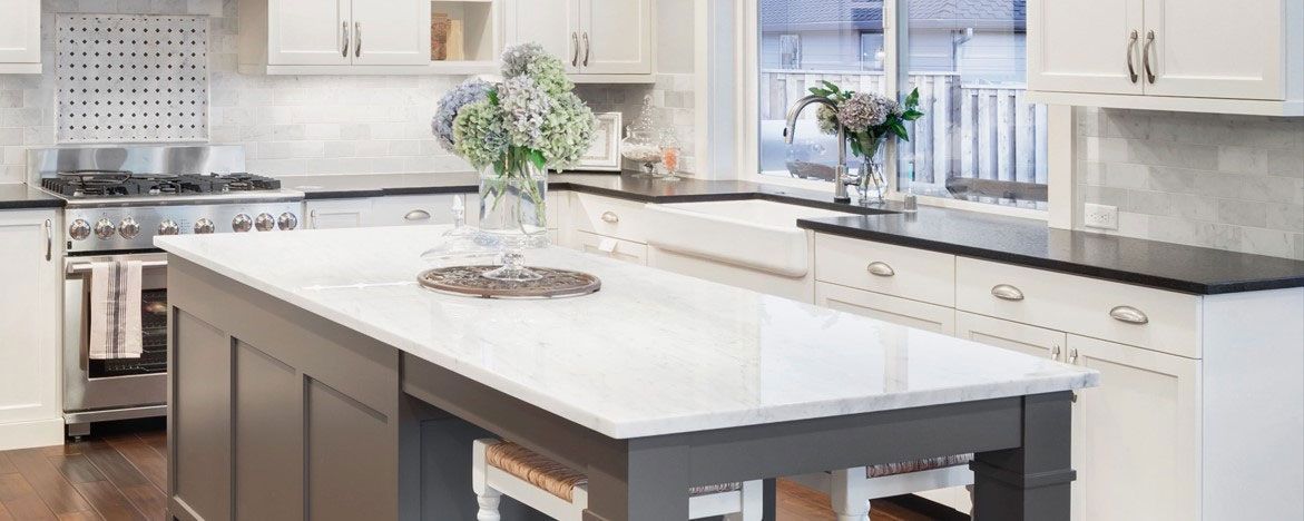 A kitchen with a large island in the middle of it