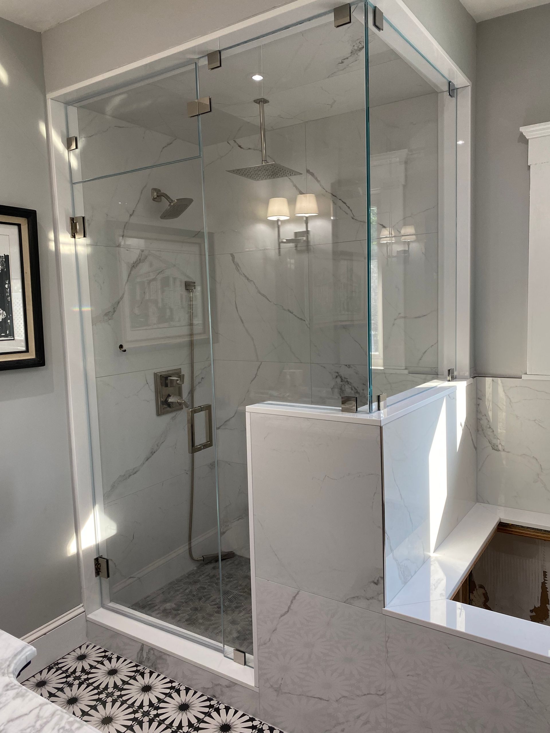 a bathroom with a walk in shower and a bathtub