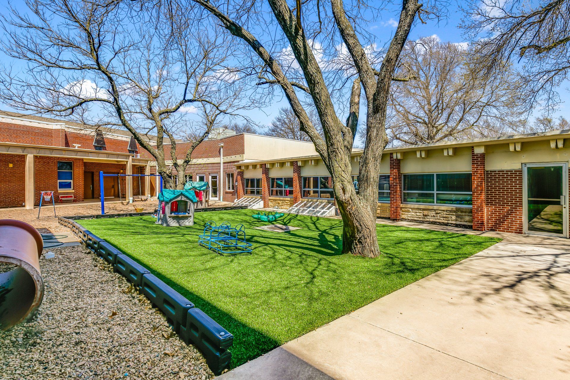 blue swing beside mini play house
