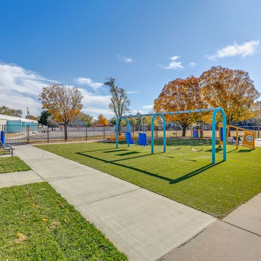 sidewalk by a swing set