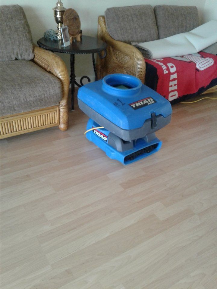 A couch with a blanket that says ohio on it