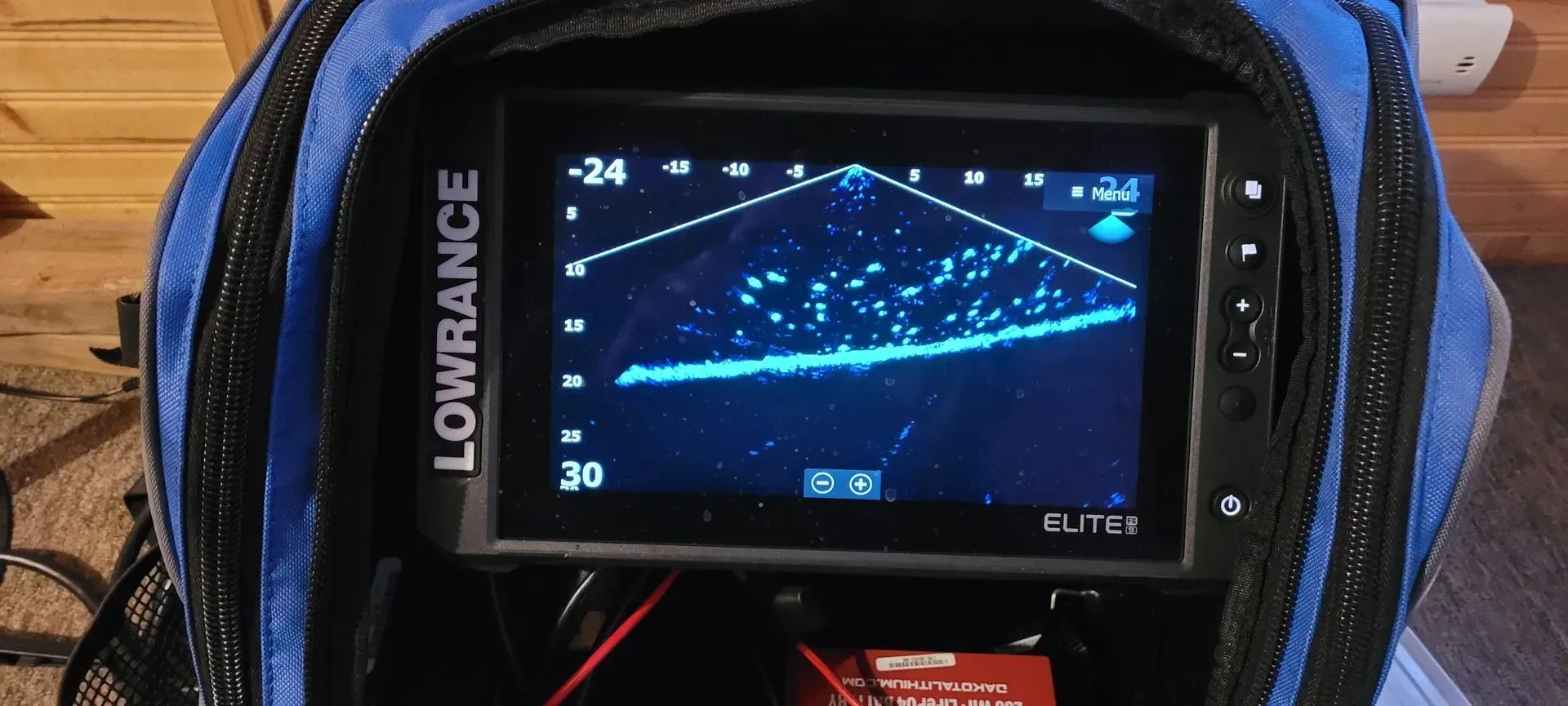 Lowrance fish finder screen showing blue sonar sonar readings on a boat console