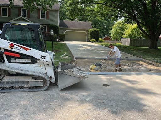 man doing driveway paving