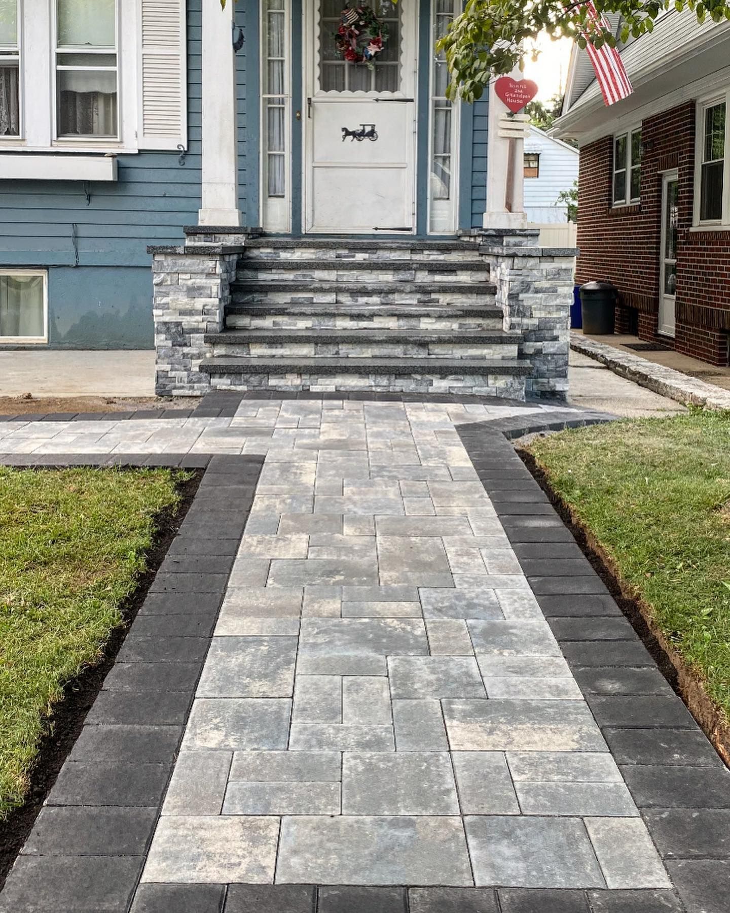 A walkway leading to the front door of a house