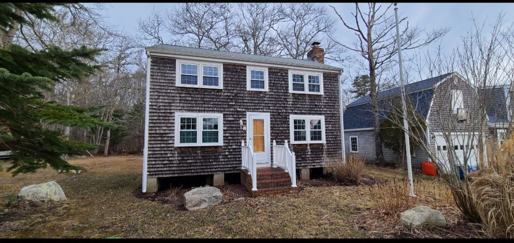 Roofing and siding work - before - front view