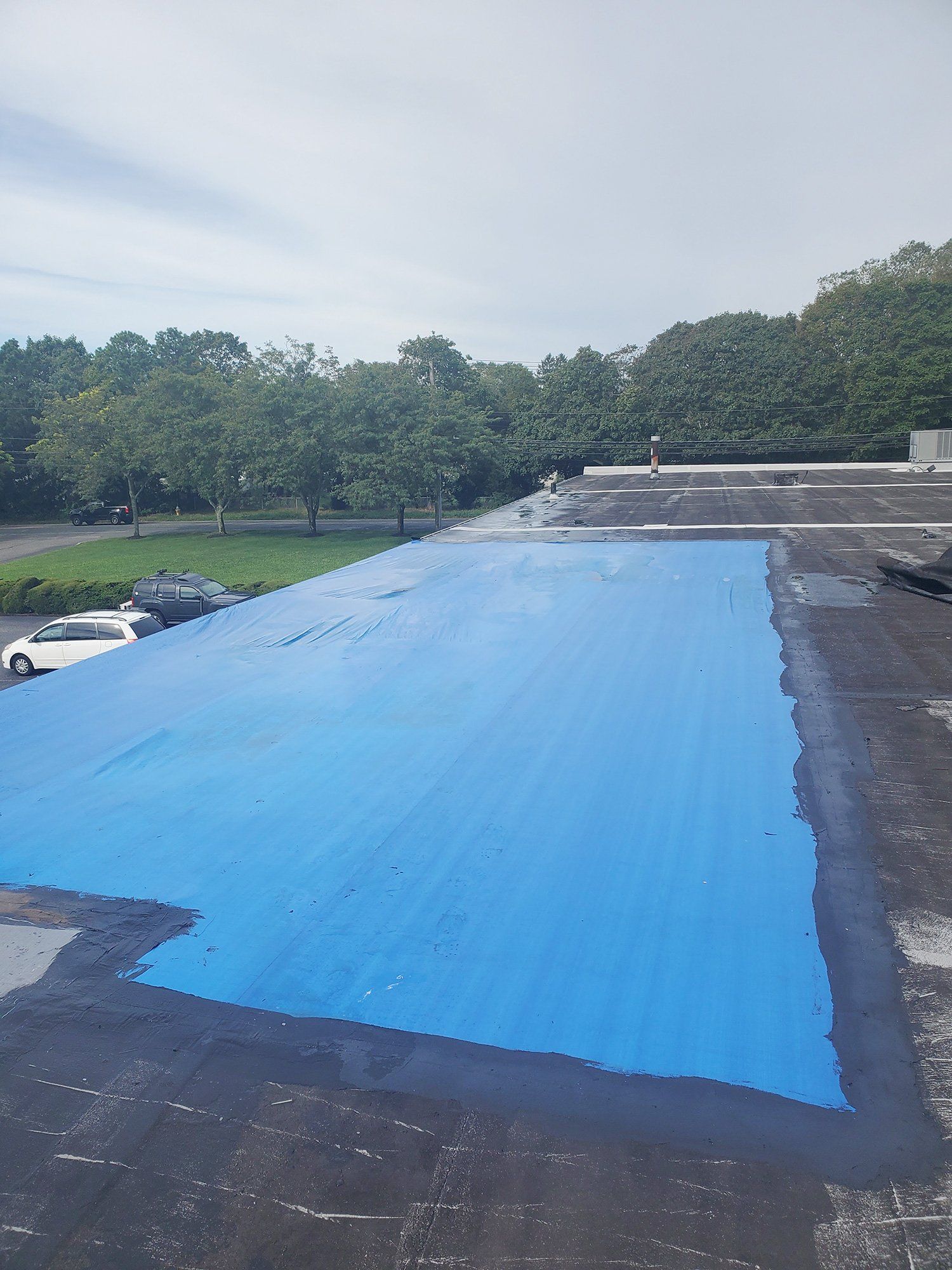 Commercial roof tarping