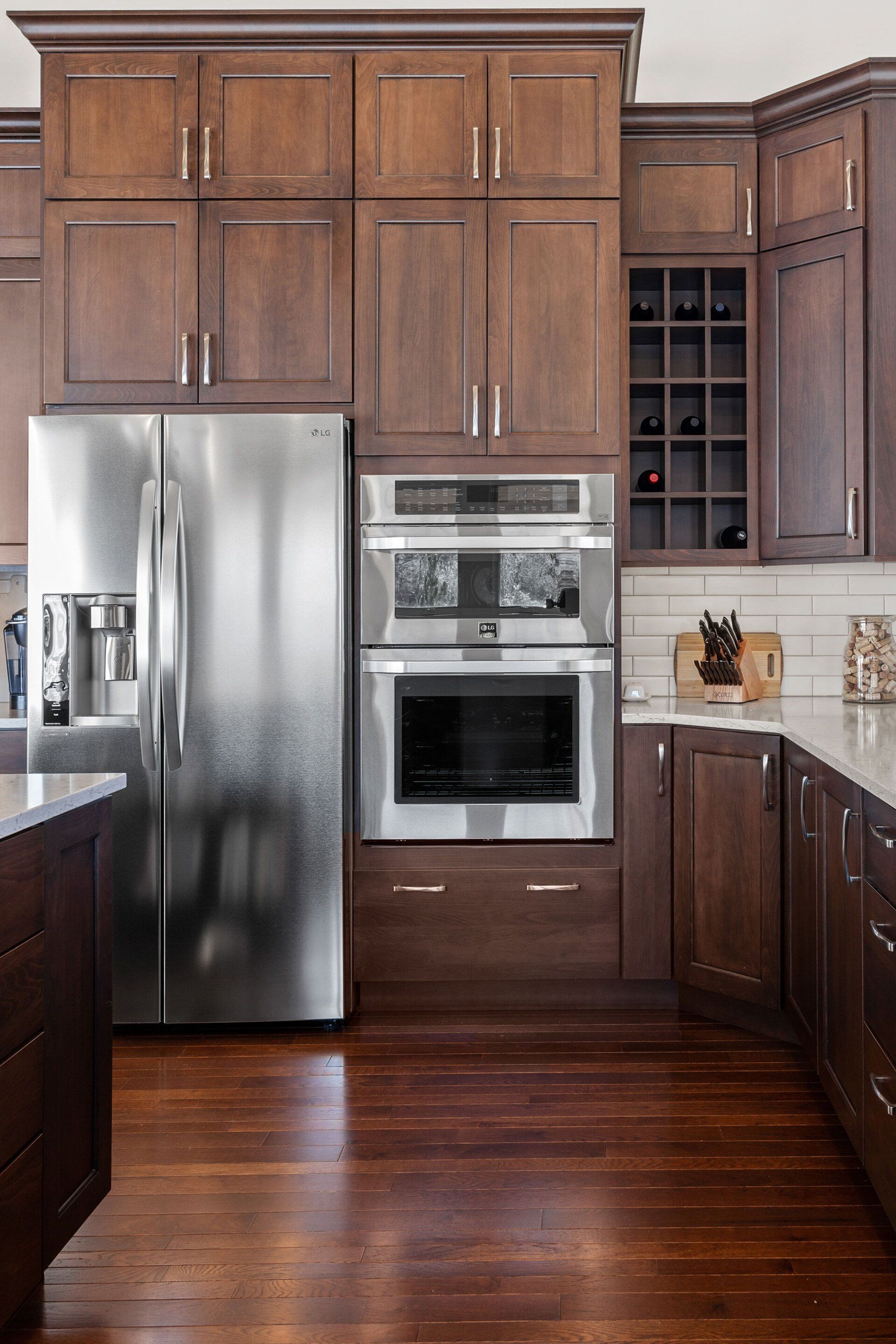 A kitchen with stainless steel appliances and wooden cabinets