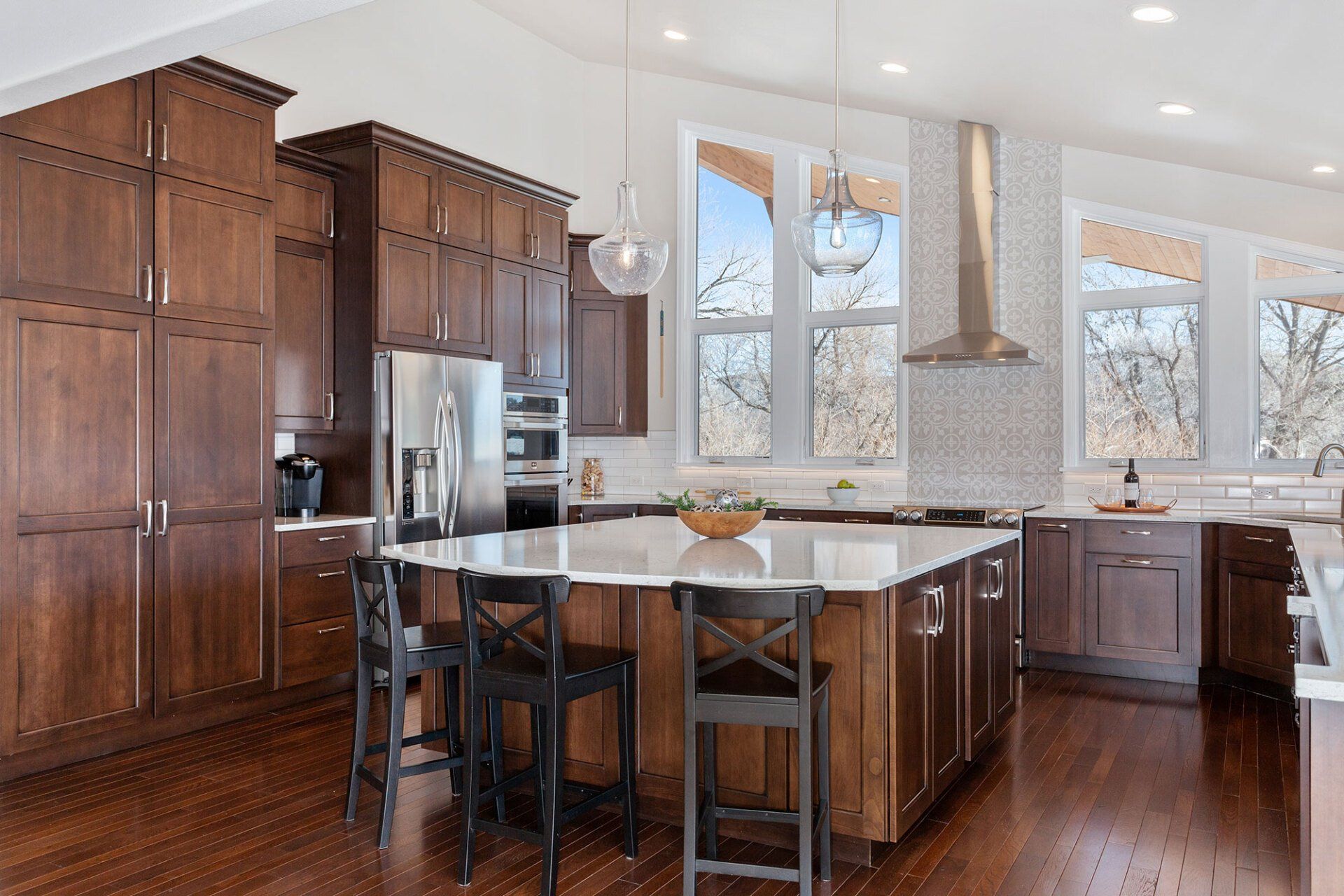 A kitchen with wooden cabinets and stainless steel appliances