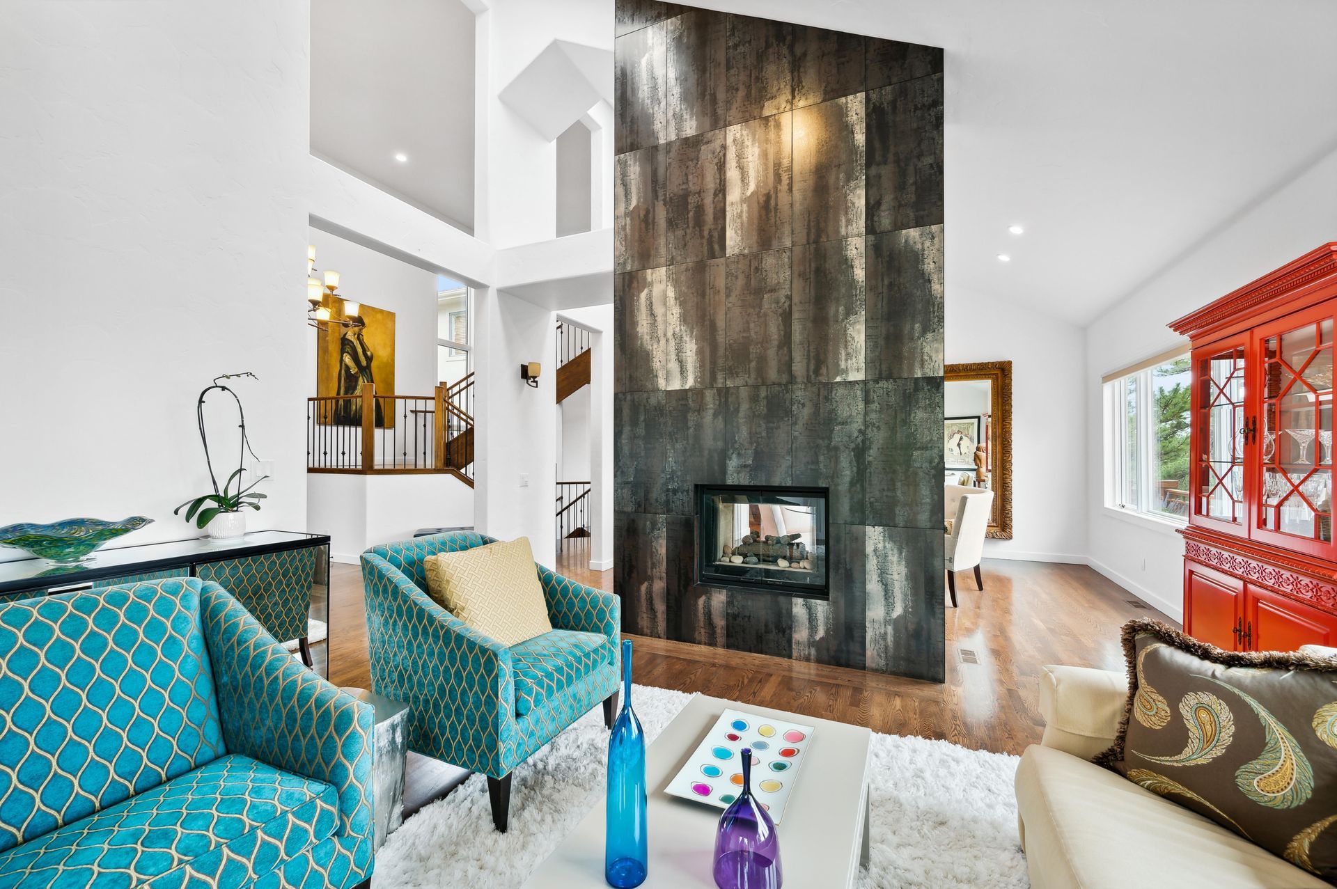 There is a fireplace in the middle of the living room.