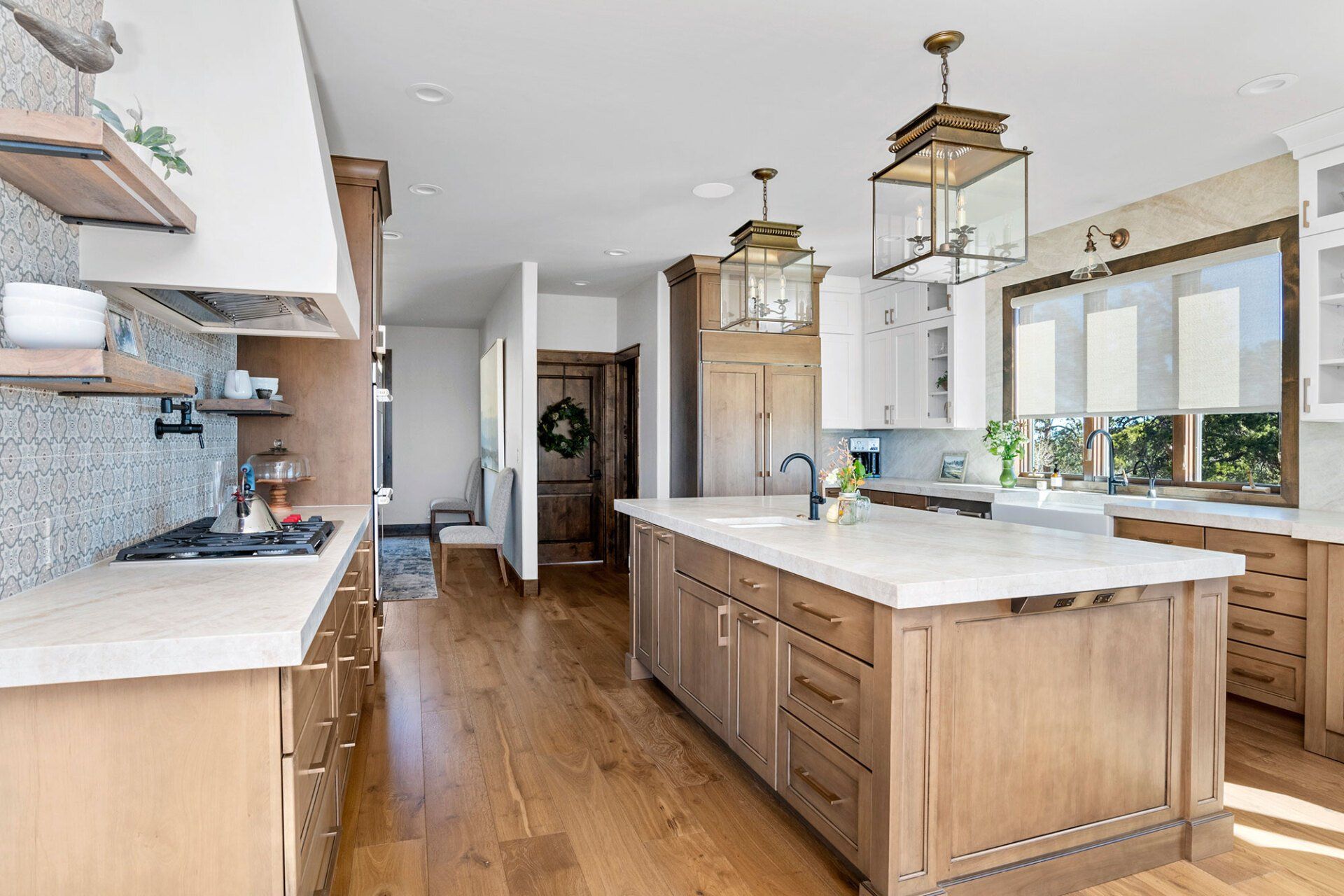 A kitchen with a large island in the middle of it.
