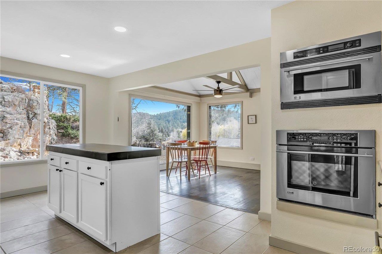 There is a large island in the middle of the kitchen.