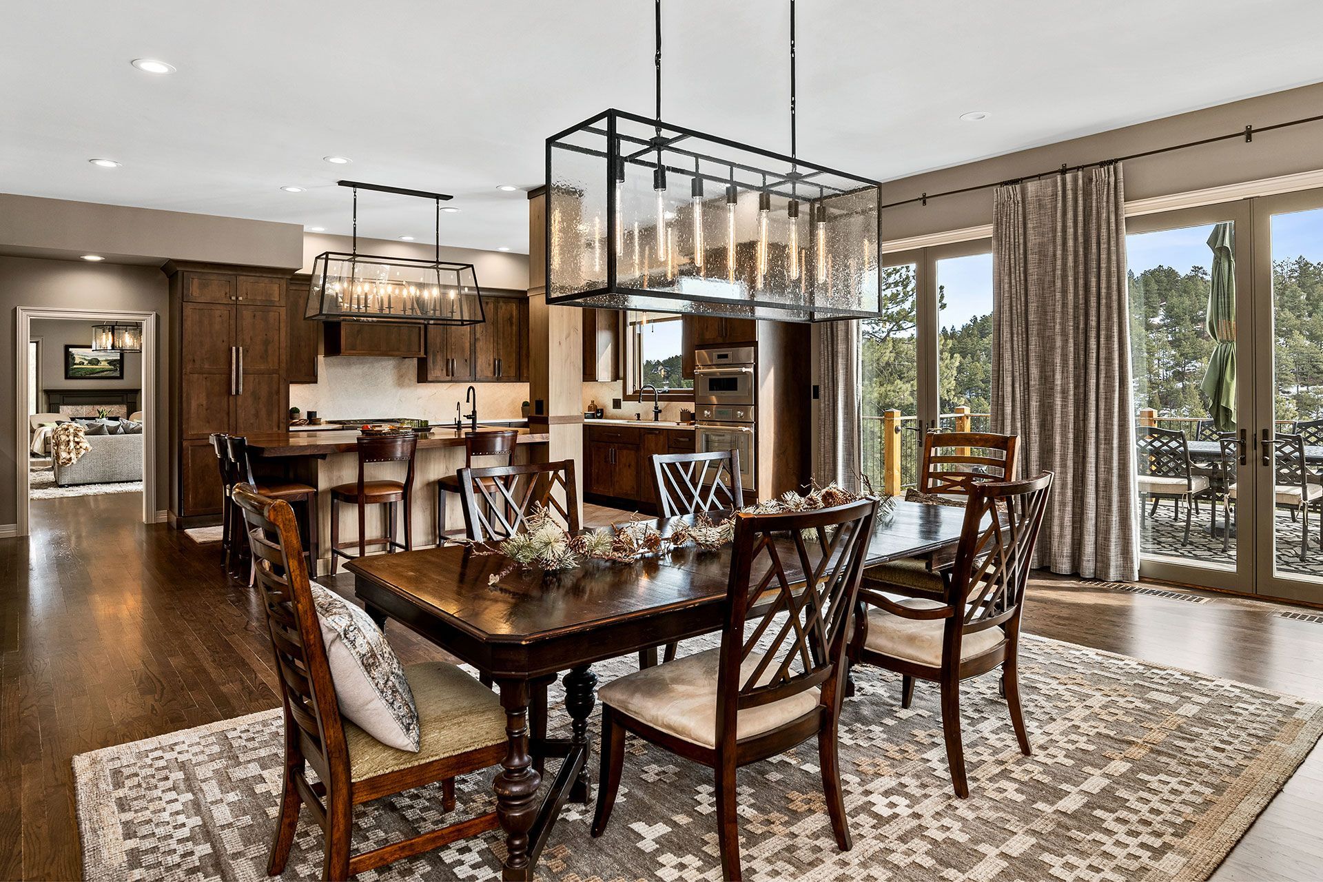 There is a dining room table and chairs in the middle of the room.