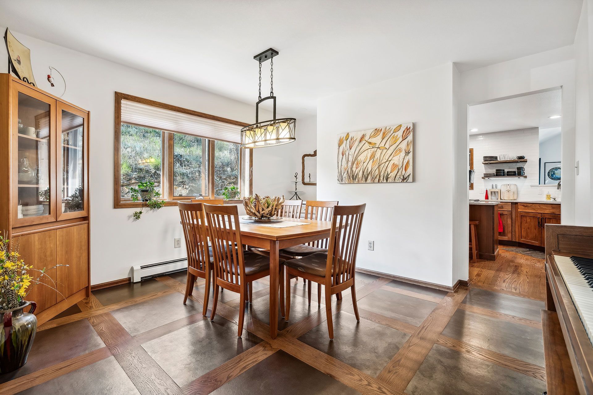 A dining room with a table and chairs in a house.