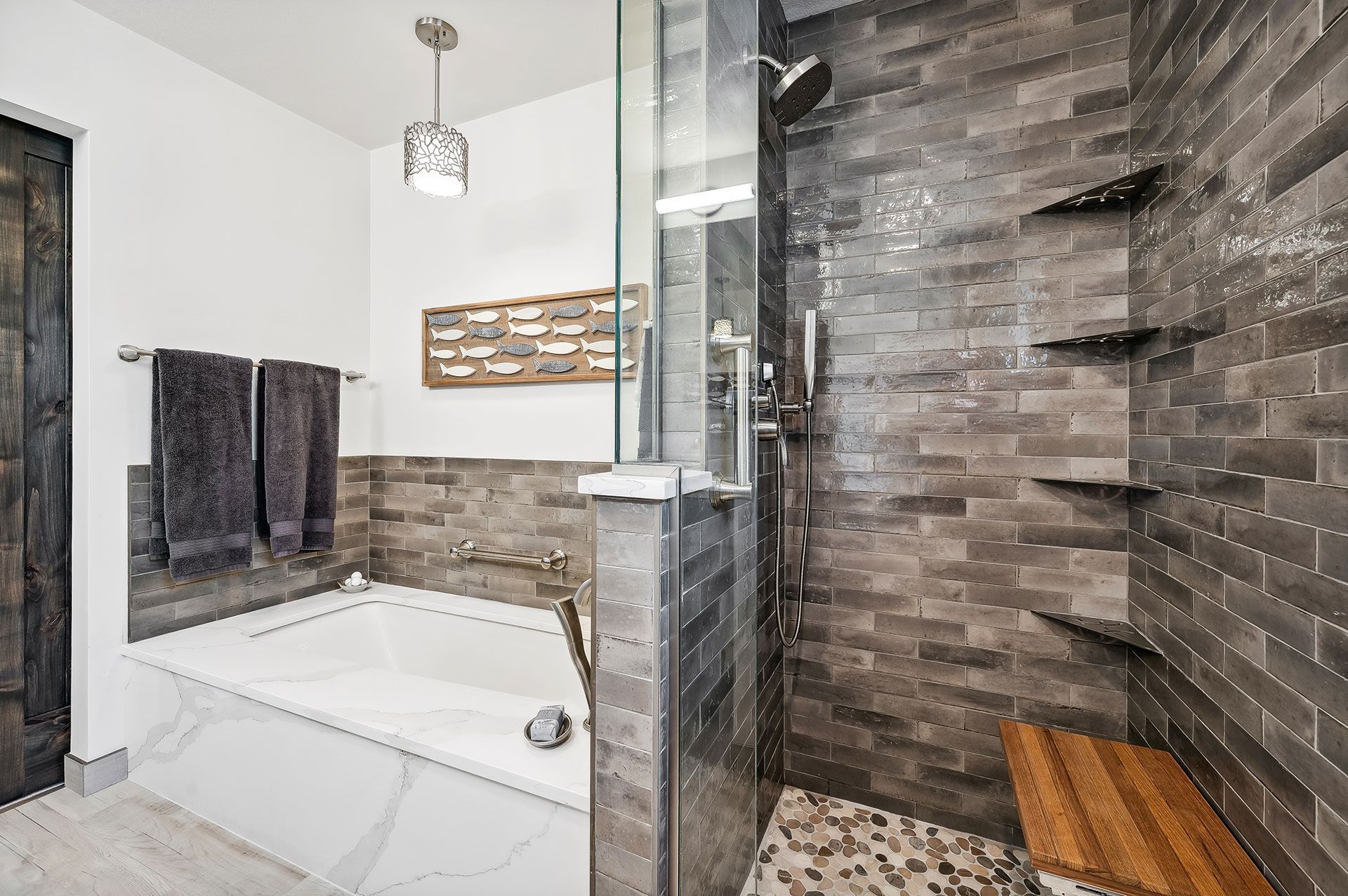 A bathroom with a bathtub and a walk in shower.