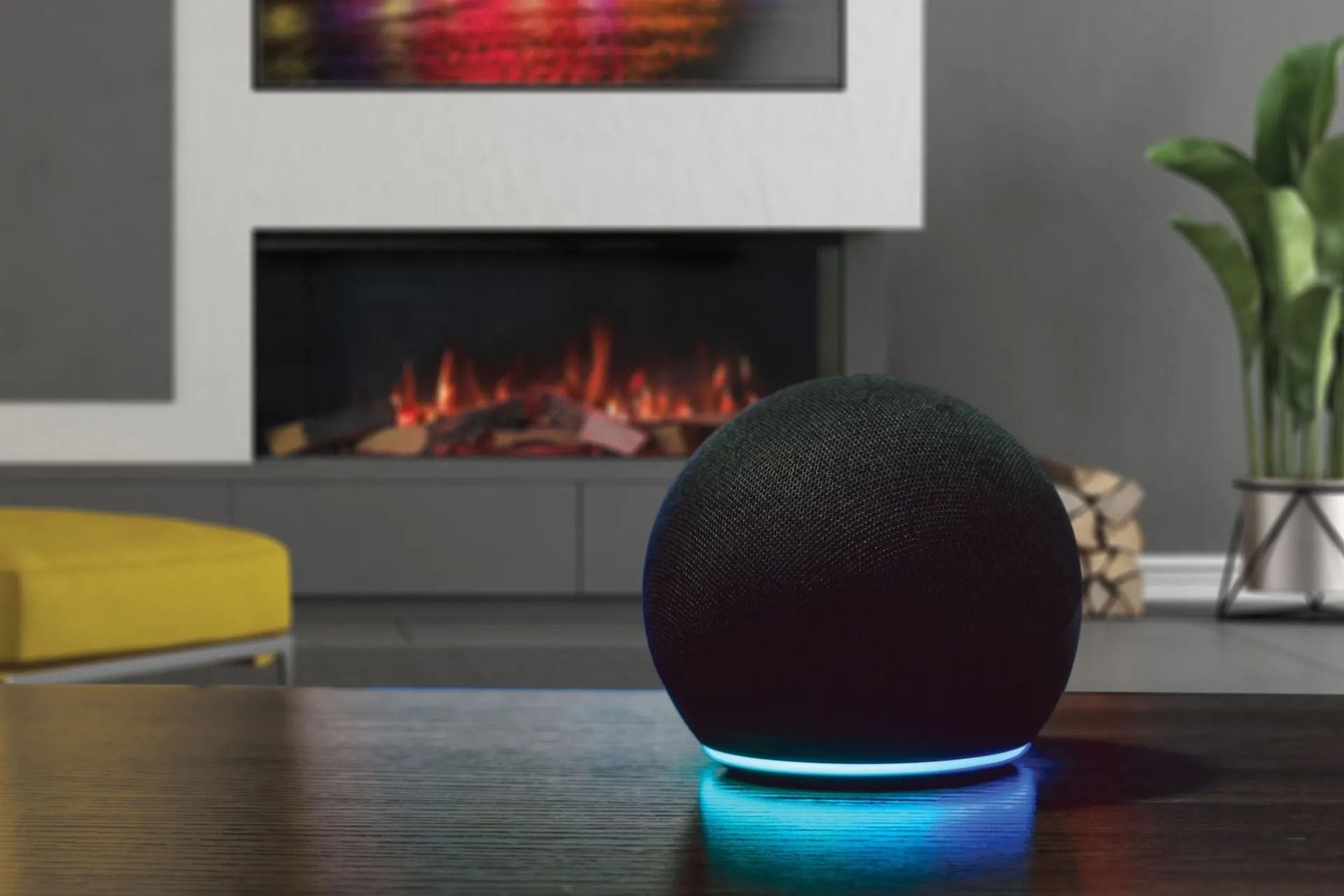 Black smart speaker on table, blue light, fireplace background.