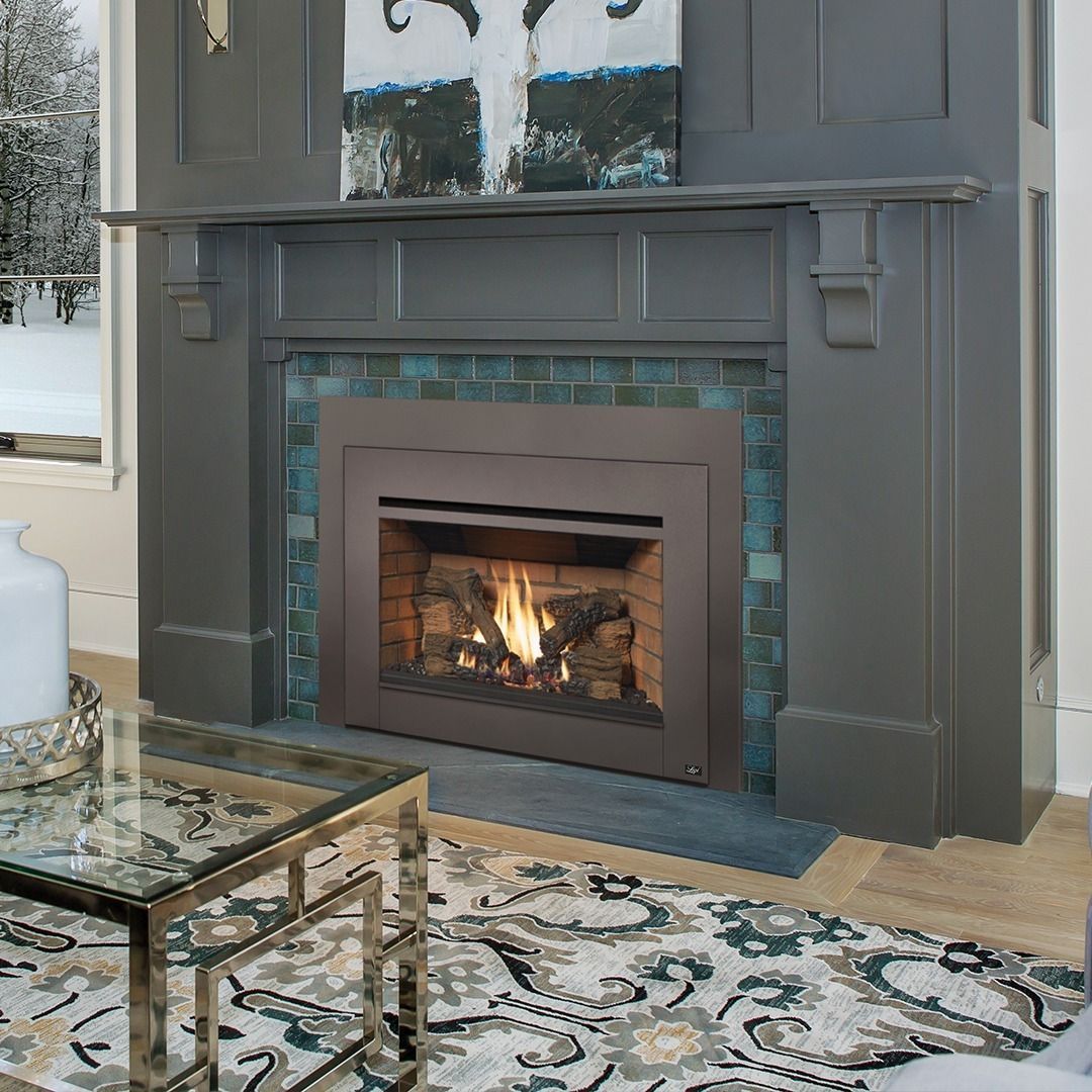 Fireplace with flames, gray mantel, teal tile surround, contemporary living room.