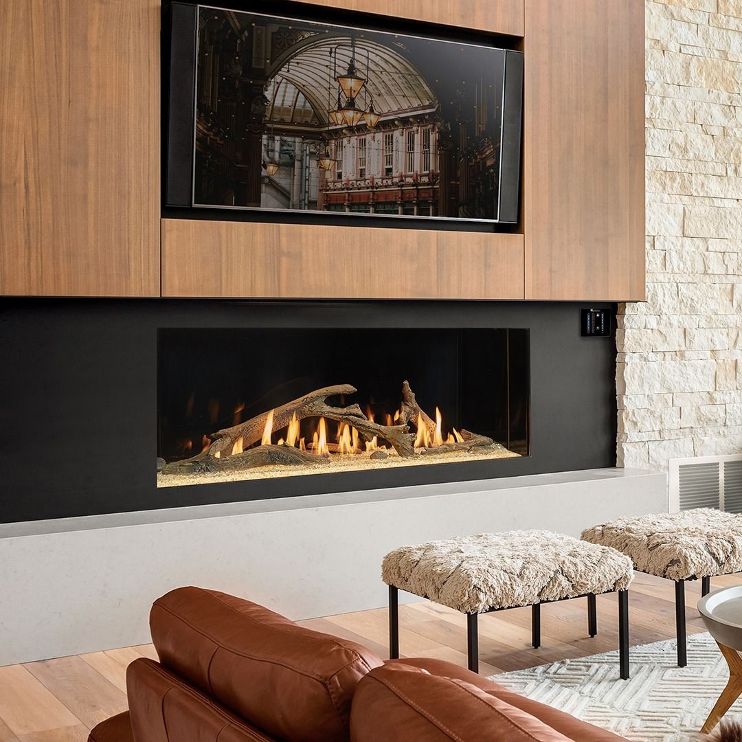 Modern living room with fireplace, television, and seating.
