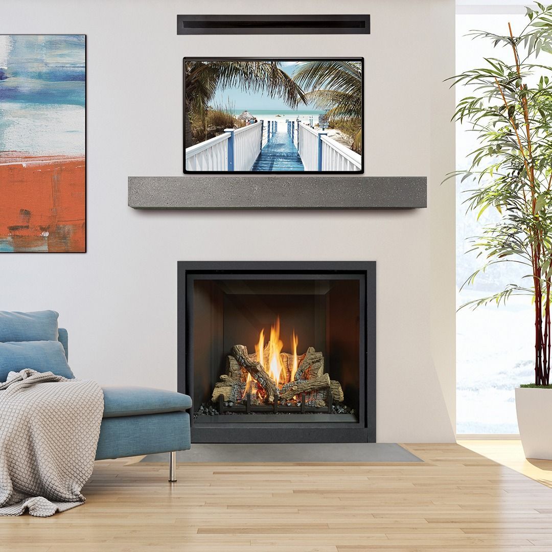 Living room with fireplace, TV above mantel, artwork, and sofa. Modern décor, neutral tones.