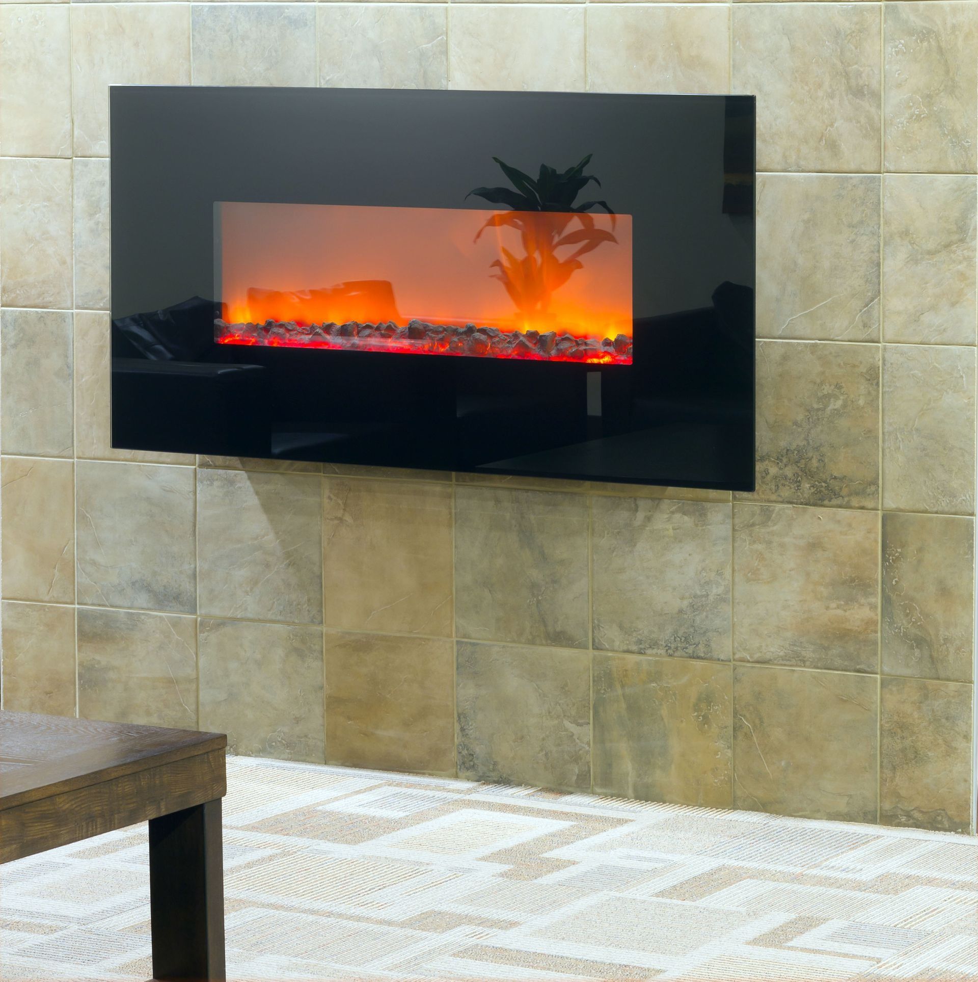 Black electric fireplace on tiled wall, lit with orange flames.