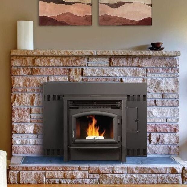 Fireplace with a pellet stove built into a stone surround.