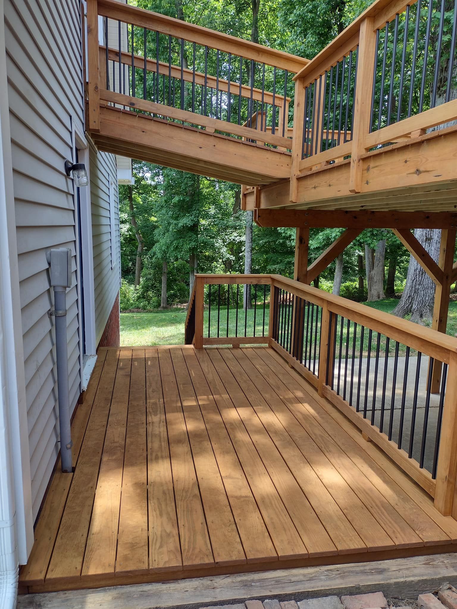 A wooden deck with stairs leading up to it