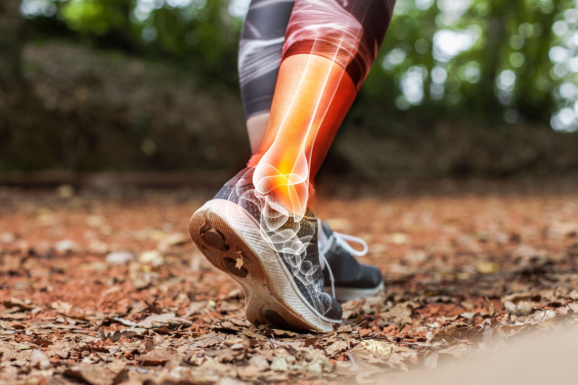 A person is walking on a trail with an ankle injury.