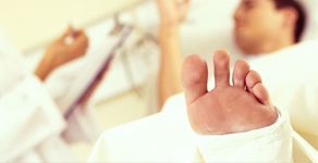 Man in the hospital with casted foot