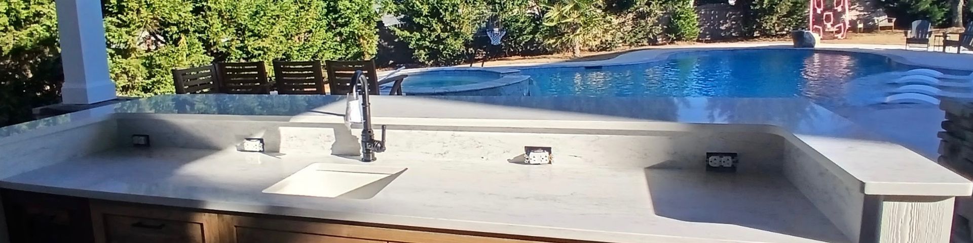 Granite is used outdoors near the pool.
