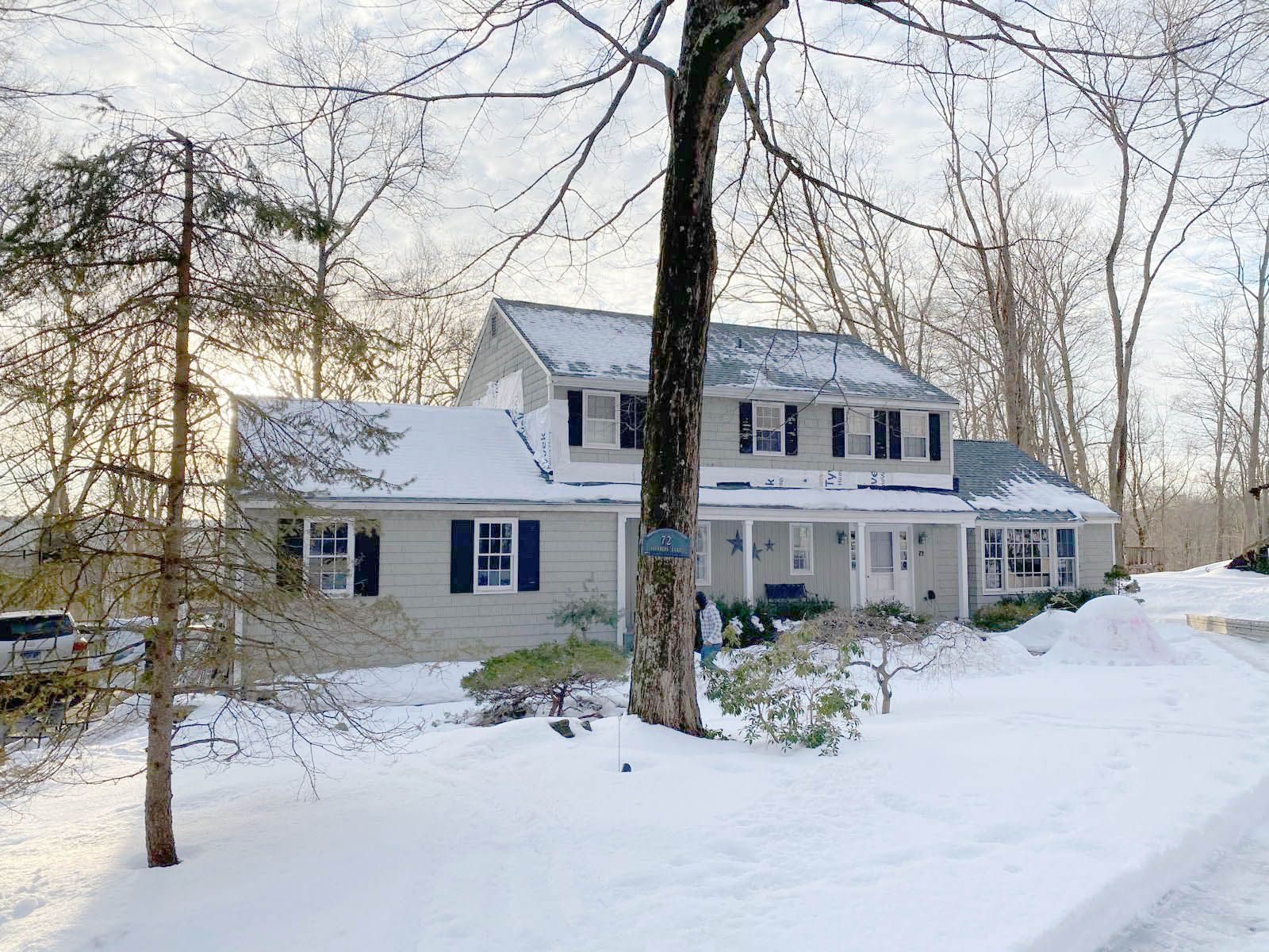 A house is covered in snow