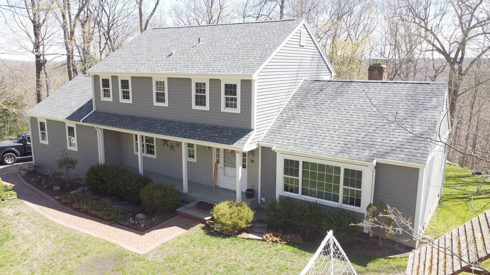 An aerial view of a large house with new roof